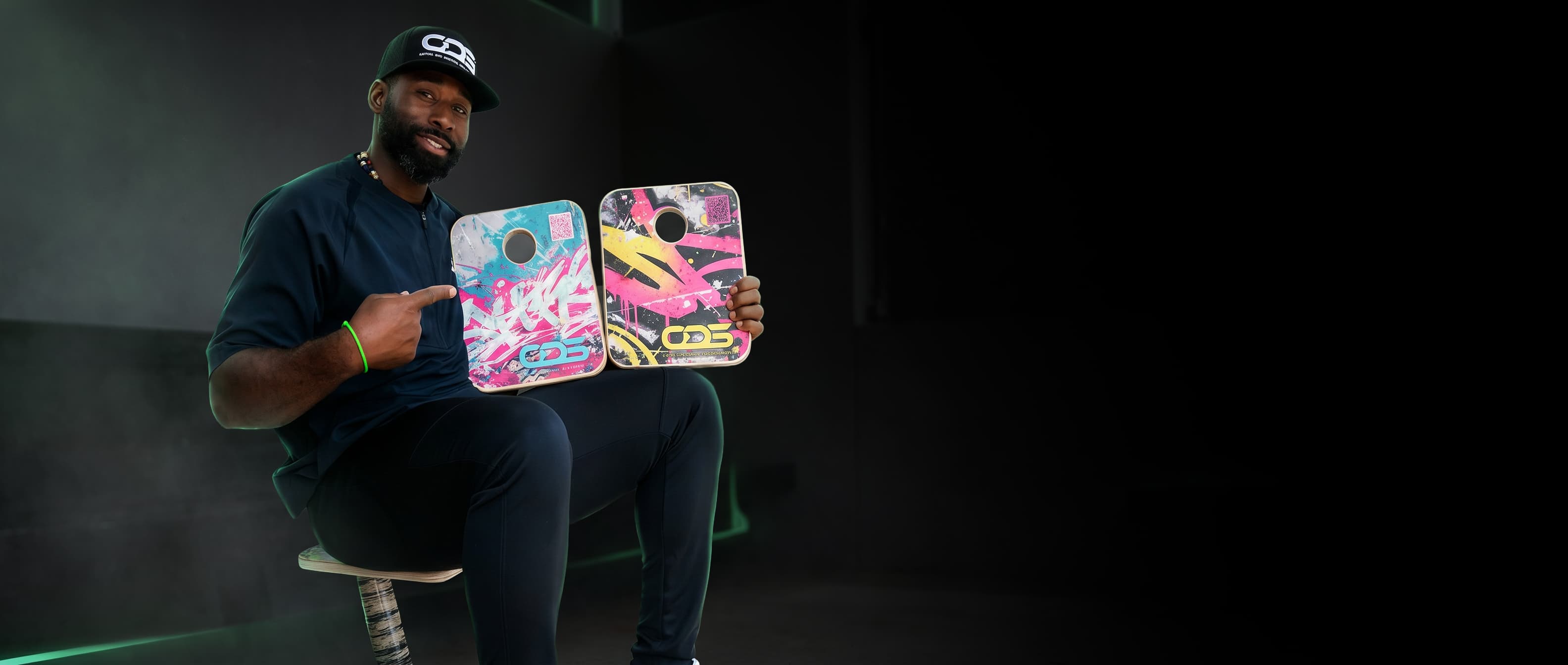 Jackie Bradley Jr. holding two ODS On Deck Seats